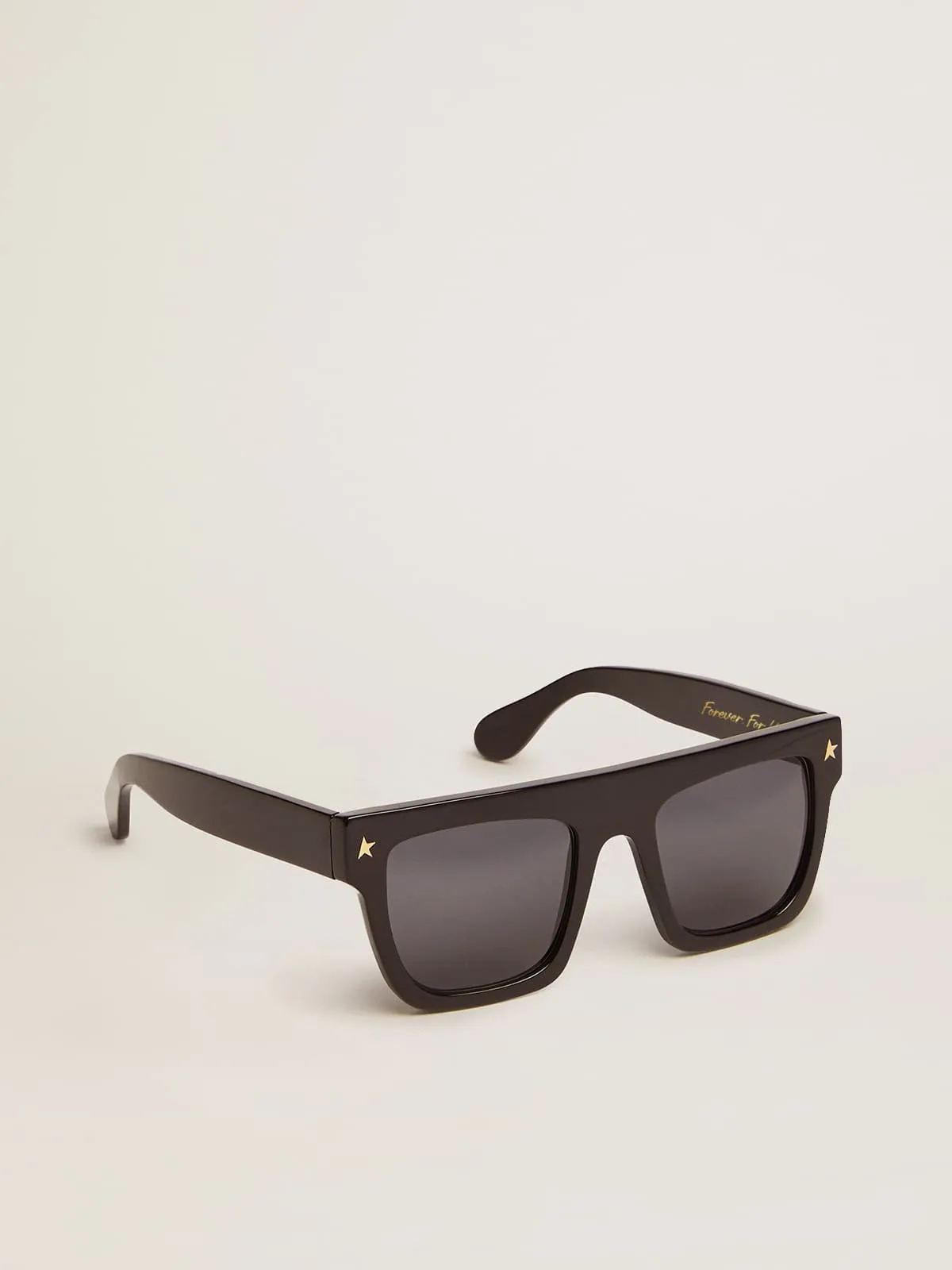 Lunettes de soleil modèle carré avec monture noire et détails dorés | Golden Goose